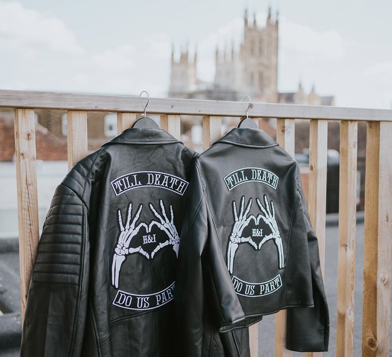 Customised matching leather jackets for the bride and groom with skull heart hands and their initials 