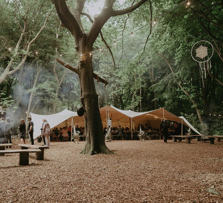 Lila's Wood woodland wedding with DIY decorations and bunting decorating the outdoor area 