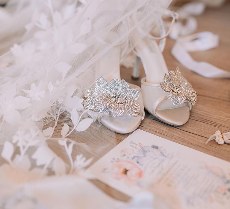 Sparkly silver wedding shoes for the bride with other bridal accessories for the day 