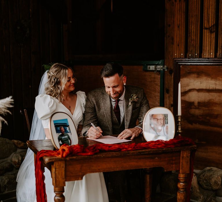 Bride in puff sleeve statement wedding dress with the groom at their Willow Marsh Farm wedding 