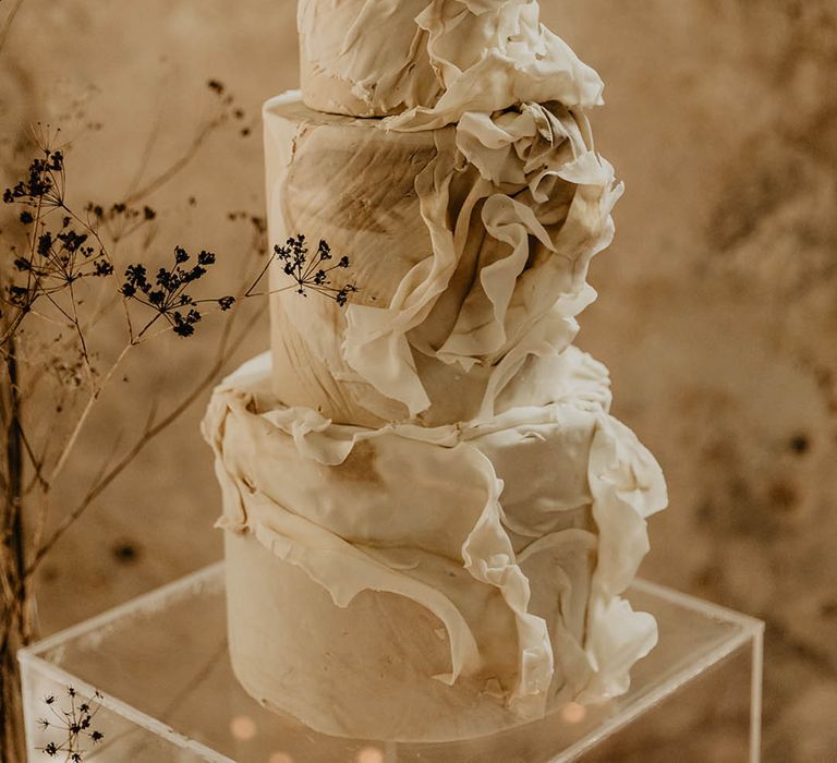 Stunning white and ivory wedding cake made by Recommended Supplier, The Painter's Pantry 