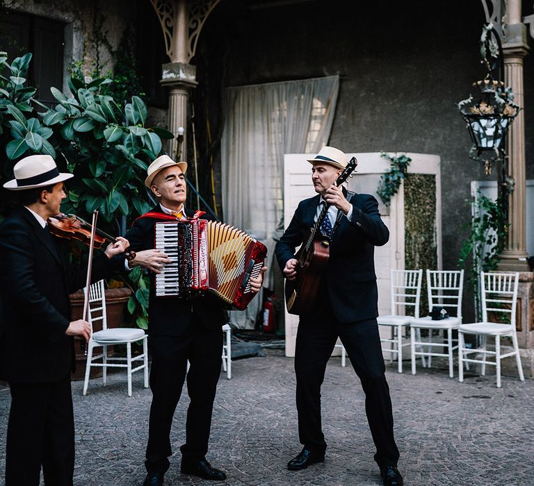 Italian trio wedding band playing as wedding entertainment 