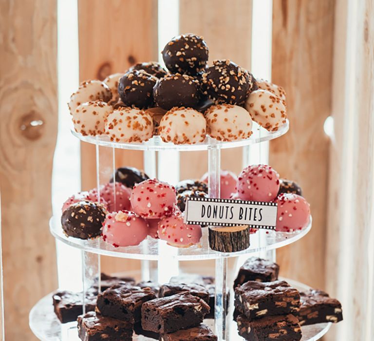 Cake stand full of desserts and sweet treats for the wedding dessert table 