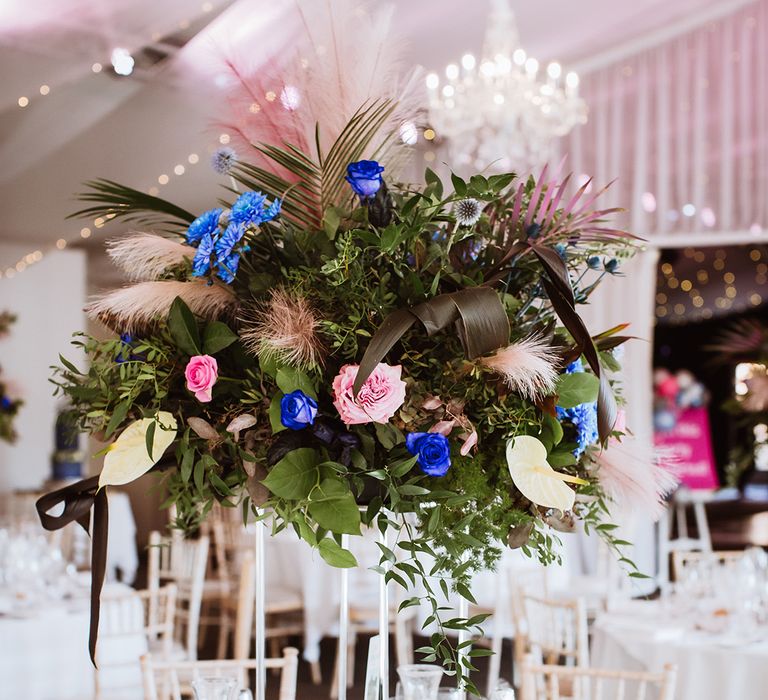 Pink and blue tall table centrepiece wedding flower arrangement for pops of colour at monochrome wedding 