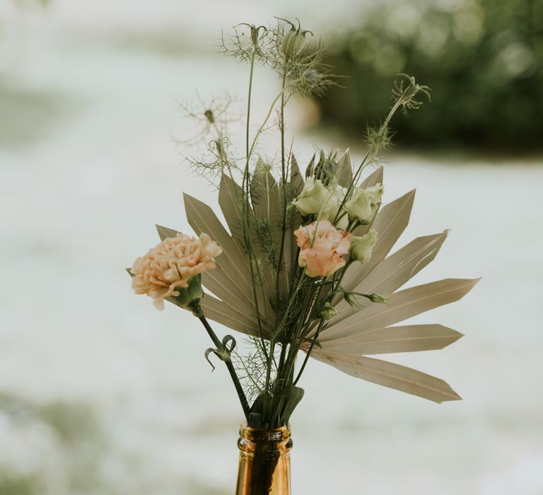 Flower stems and dried leafs in bottle 