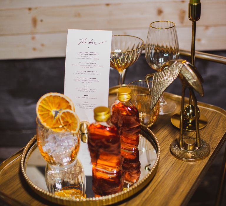 Wedding bar with menu and drinks on reflective tray