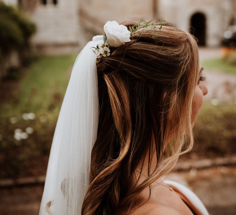 Half up half down wedding hair with flowers and wedding veil 