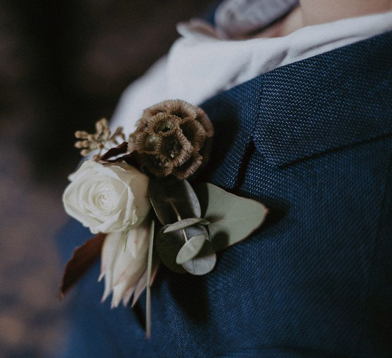 White rose and dried flower grooms buttonhole 