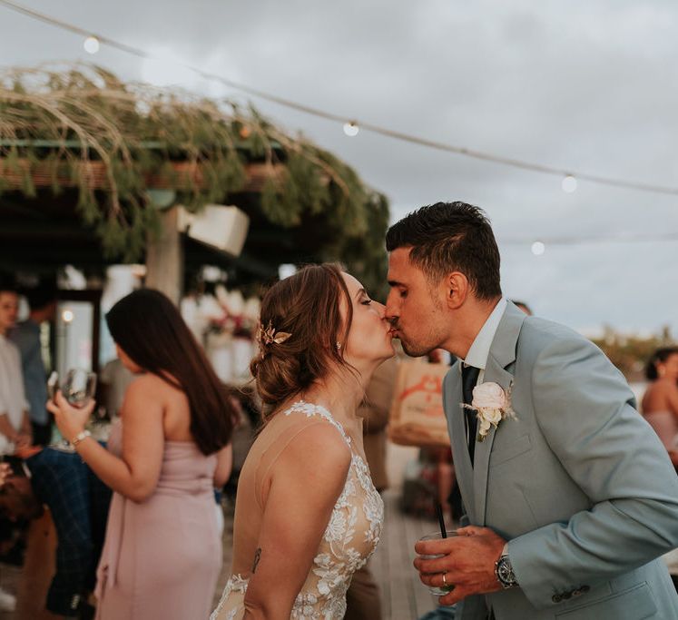 Bride and groom share a kiss