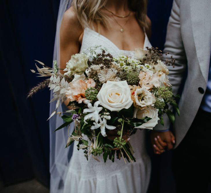 Close up of bride holding bouquet 