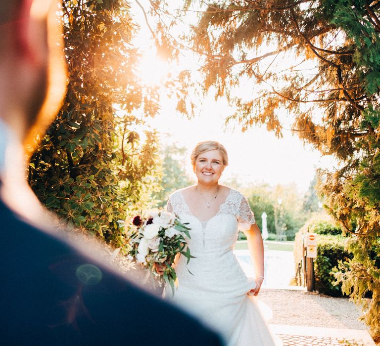 The bride looking lovingly at the groom after their ceremony