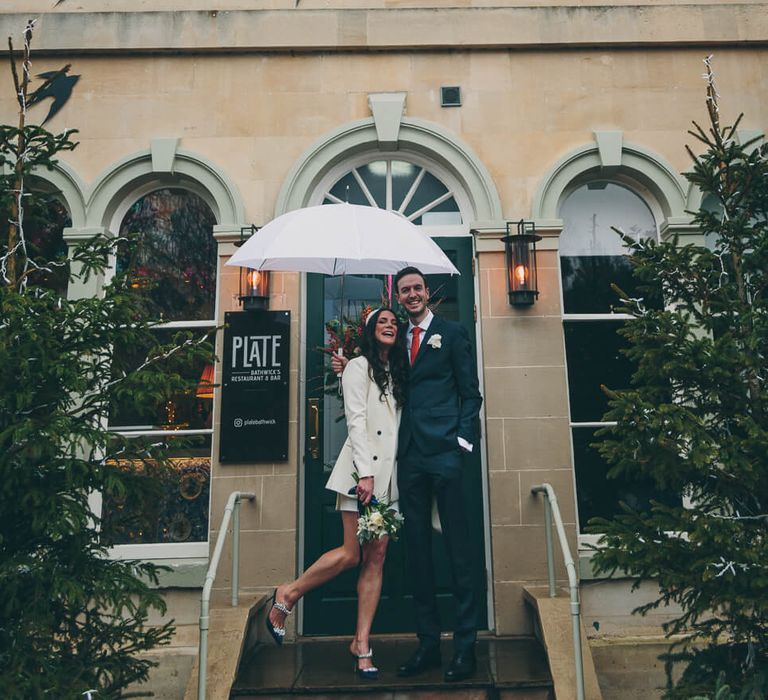 Bride and groom at the bird in bath on their wedding day