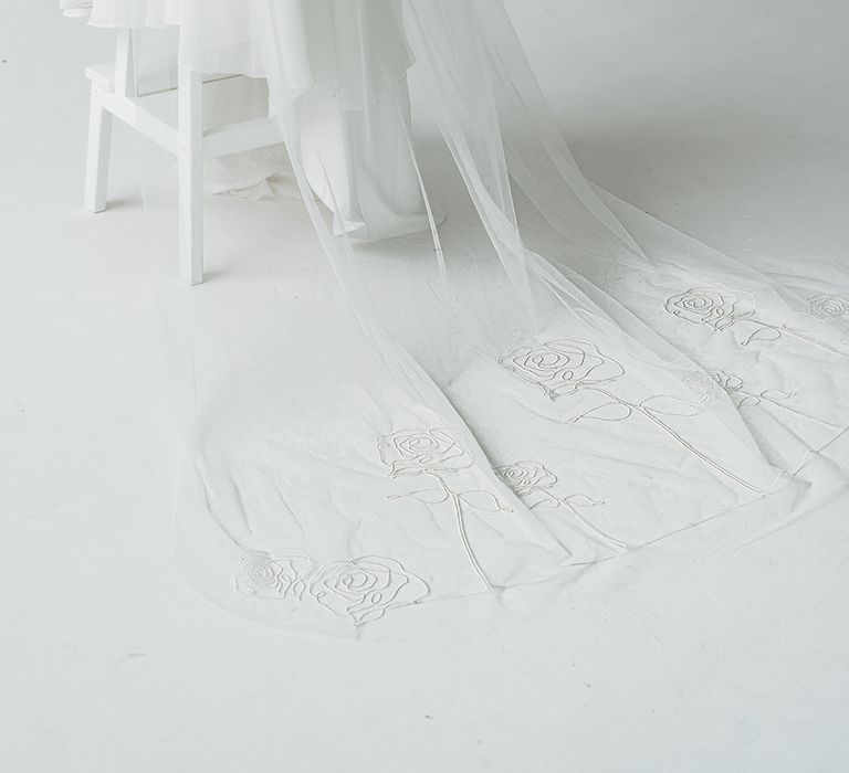 Cathedral length wedding veil with rose embroidered designs on the train 