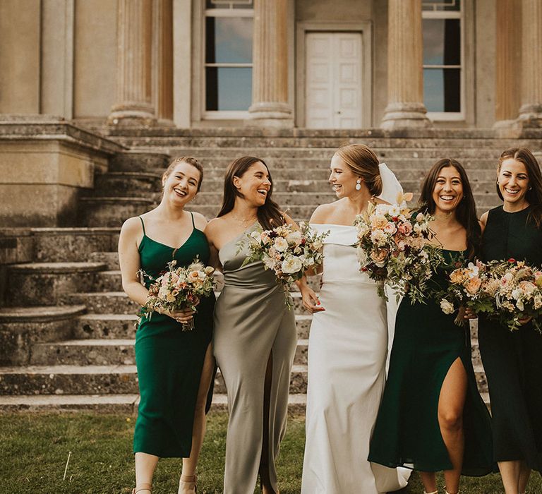 Bride stands with her bridesmaids on her wedding day