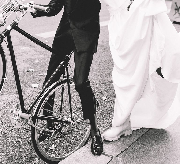 Paris wedding elopement with Black groom in a tuxedo and South Asian bride in a puff sleeve wedding dress