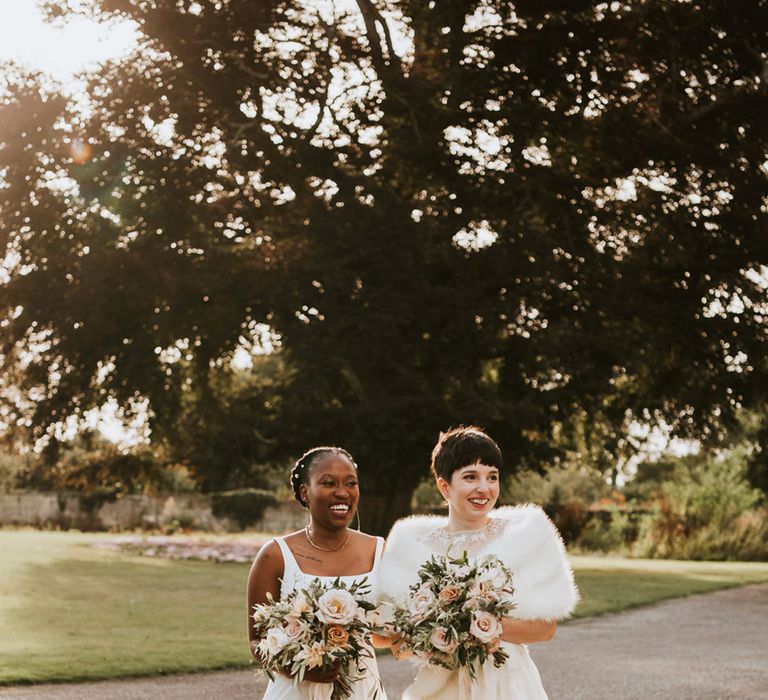 LGBTQI+ wedding at Elmore Court With Black bride in a Essense of Australia wedding dress and bride with short hair in a Anna Kara wedding dress 