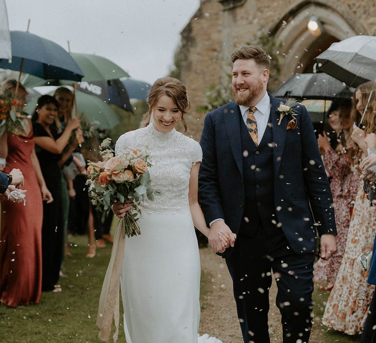 Confetti moment for bride and groom at church ceremony