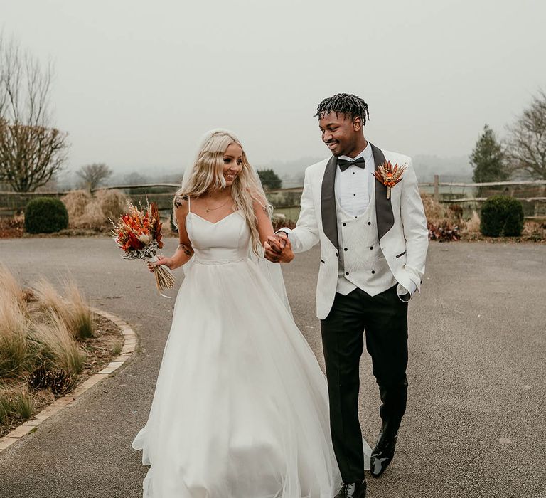 Bride and groom at black tie winter wedding