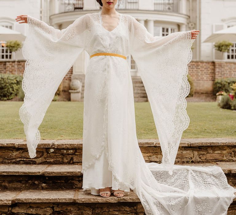 Bride in a lace kimono style wedding dress with long sleeves at Gorse Hill Japanese wedding inspiration shoot 