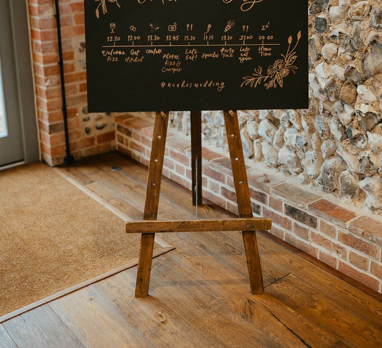 Black and gold rectangle order of the day wedding sign 