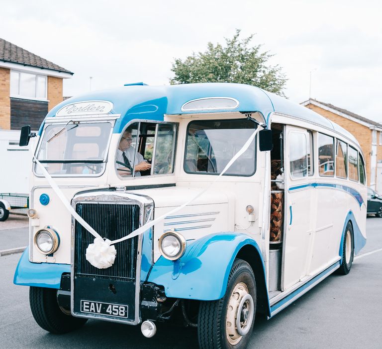 Blue & white vintage wedding bus transport