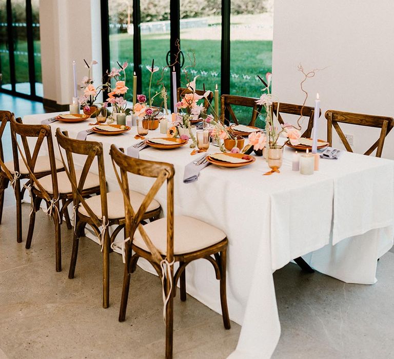 Lavender, rust and green wedding table setting for an autumnal wedding 