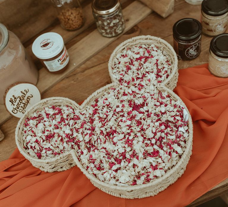 Mickey Mouse shaped bowl full of confetti on the table for the chocolate station