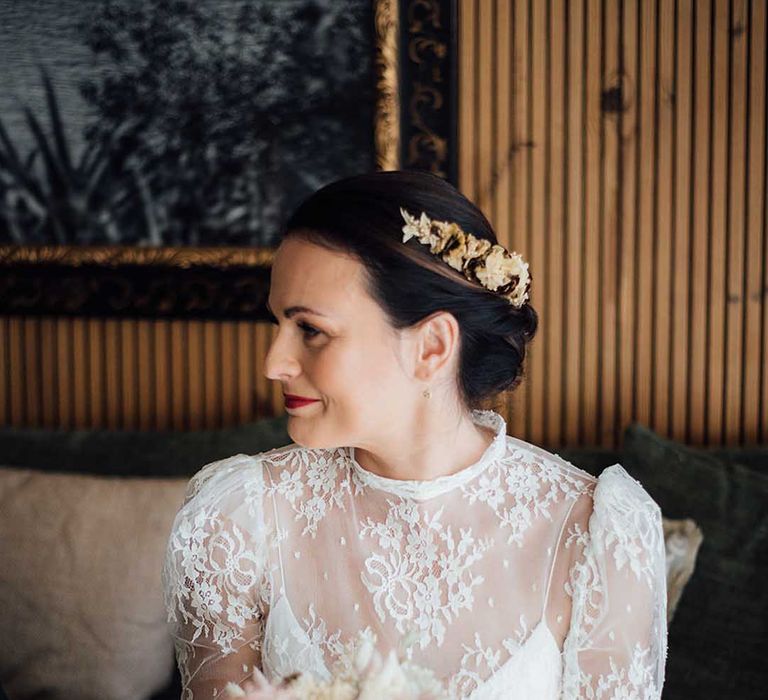 boho bride in a lace wedding dress with dried flower crown and wedding bouquet 