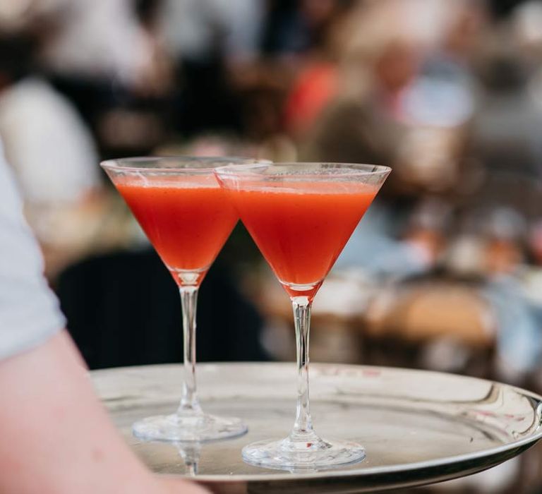 Two red wedding cocktails on serving platter at Viking themed wedding