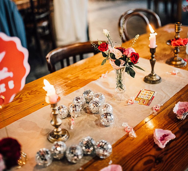 tiny disco ball wedding table decorations at quirky coastal wedding 