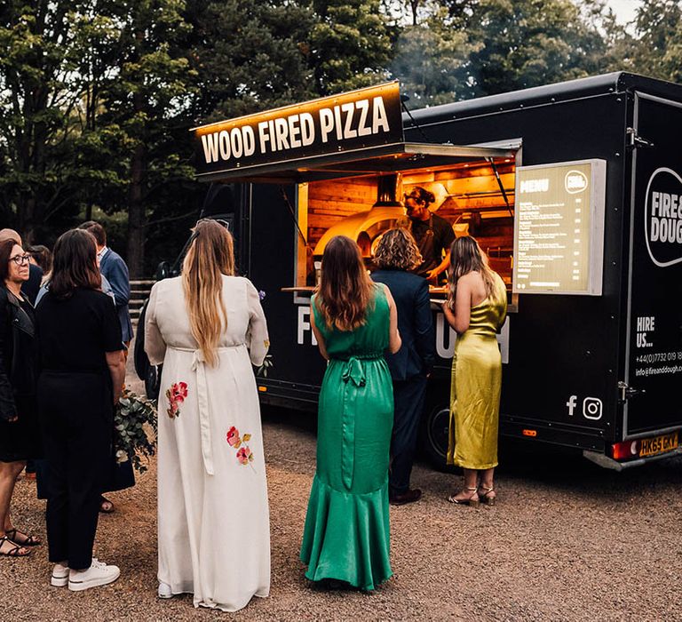 Outdoor wood fired pizza wedding food idea for relaxed and laid back boho wedding 