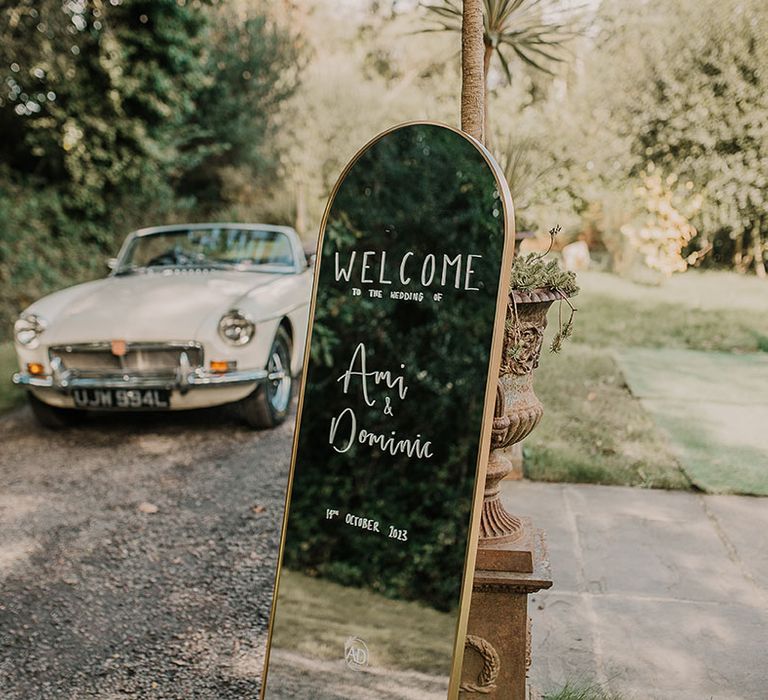 Gold mirror wedding welcome sign DIY'd by the bride 