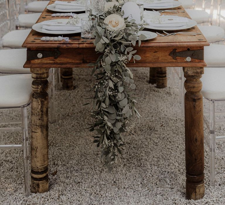 Simple and minimalist wedding tablescape with foliage for rustic al fresco dining at dinner party wedding 