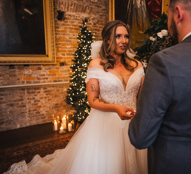 The bride and groom have their civil wedding ceremony with Christmas theme for December wedding 