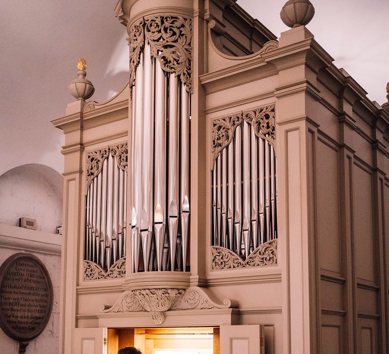 Pianist plays at the wedding ceremony in the cathedral 