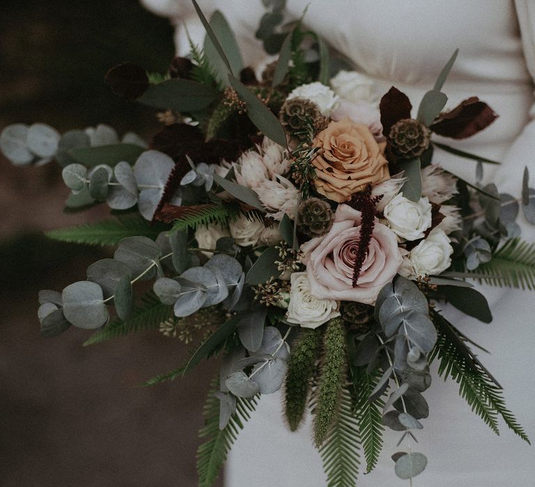 Wedding bouquet with eucalyptus and roses 