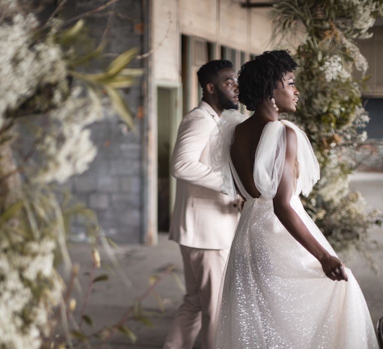 Bride with short afro hair wearing a sparkly Berta wedding dress