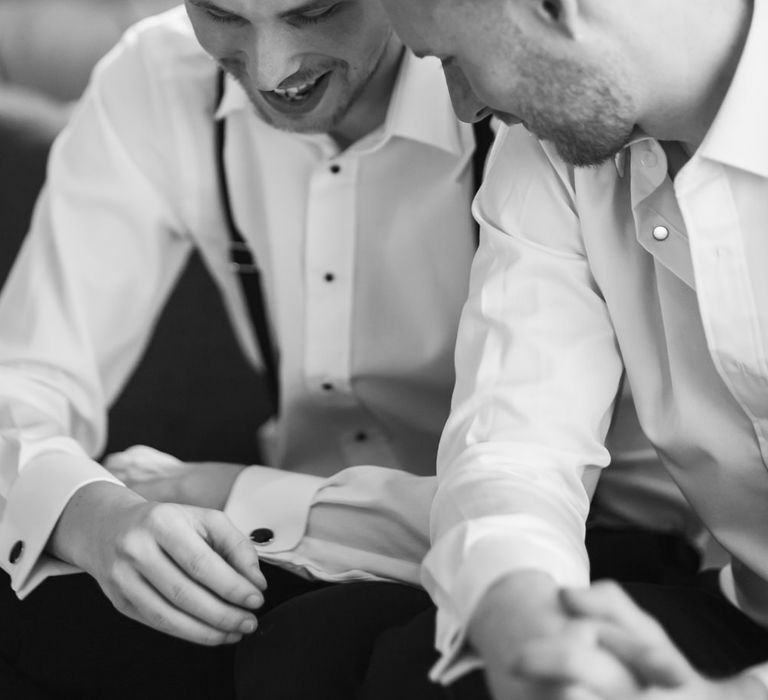 Two grooms getting ready on the wedding morning 