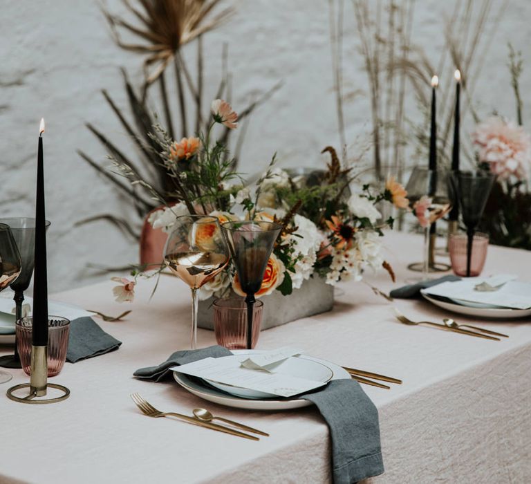 Dark greys, rose gold and blush pink with dried flower centrepiece for a contemporary wedding table