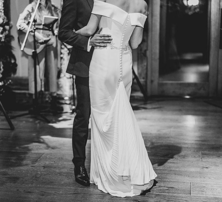 Black & white image of bride & groom during their first dance