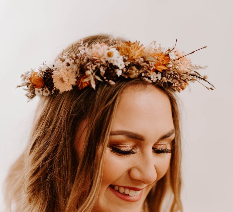 Flower crown for boho bride in fringe sleeve wedding dress