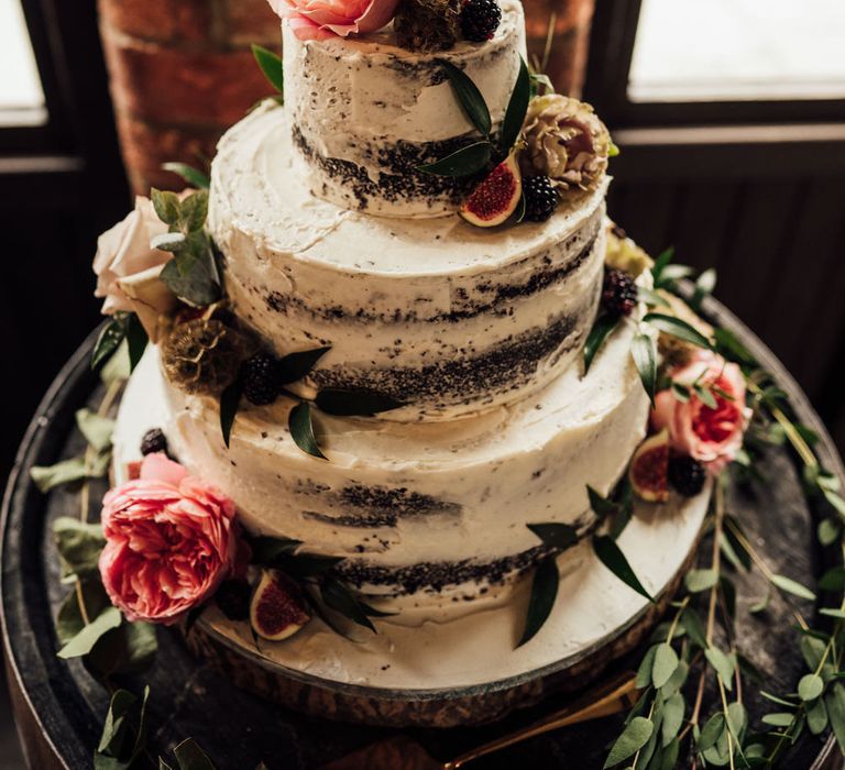 Bronze wire wedding cake topper of the couples name intertwined 