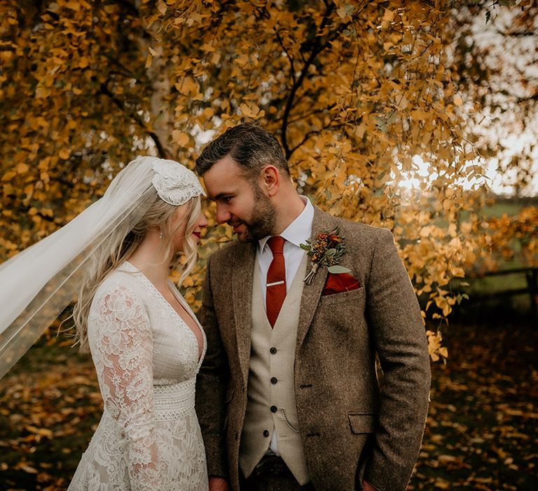 Bride and groom portrait at their Lyde court autumn wedding 