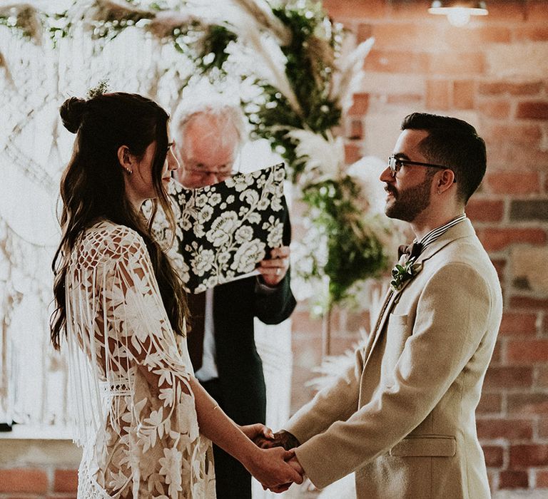 Bride & groom look at one another on the day of their wedding