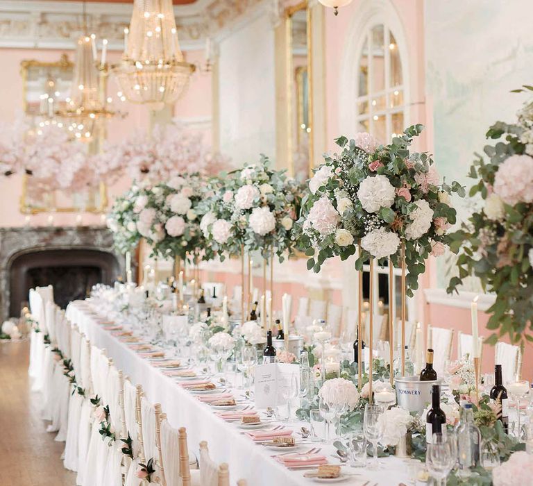 Danesfield House wedding reception complete with large floral bouquets along table centre and blush pink colour scheme