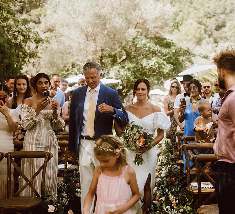 Father of the bride walks bride down the aisle 