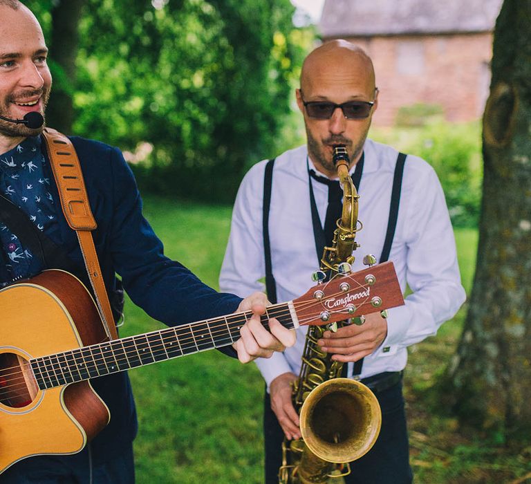 Live band wedding entertainment with man playing saxophone