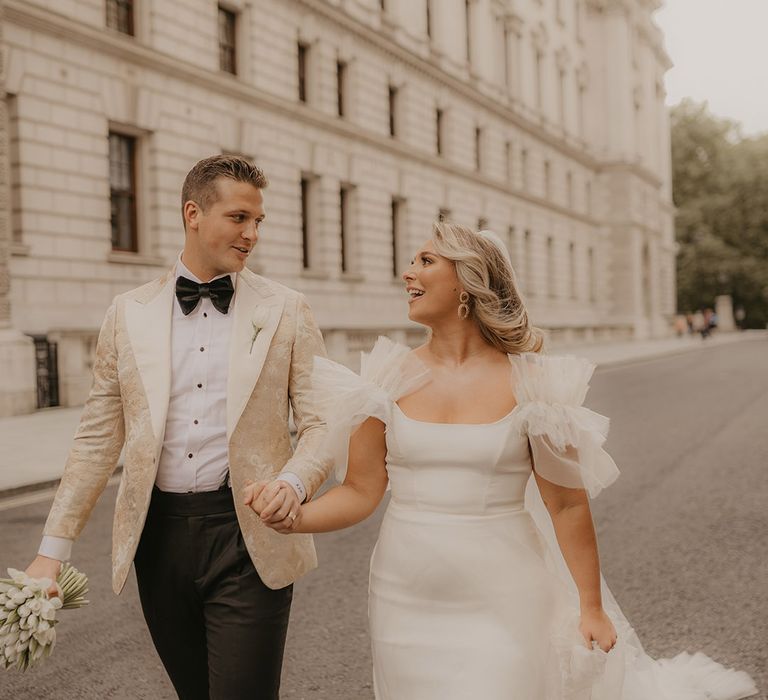 Bride and groom walk around the streets of London for their stunning couple portraits