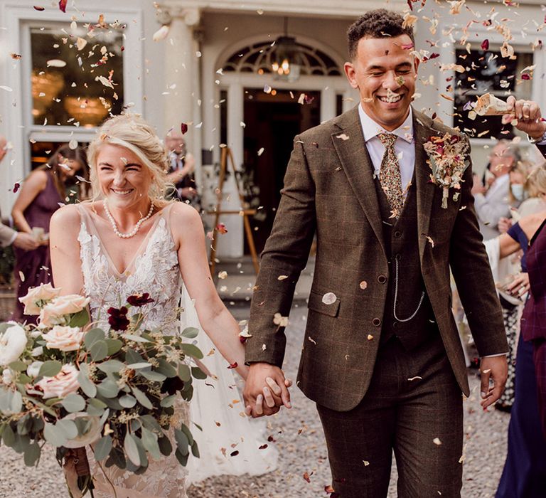 Bride and groom have their confetti exit after wedding ceremony at No.38 The Park