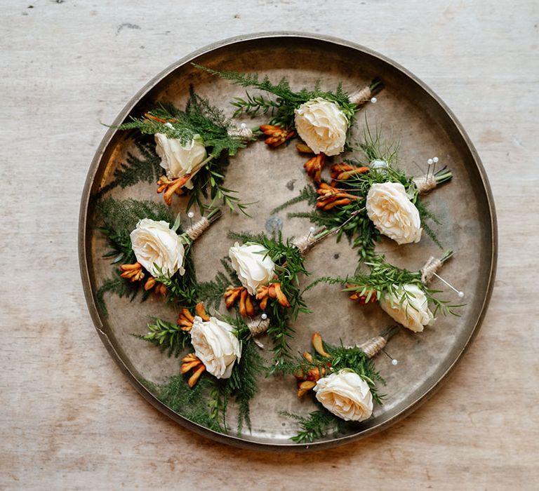 White flower buttonholes for groom and groomsmen